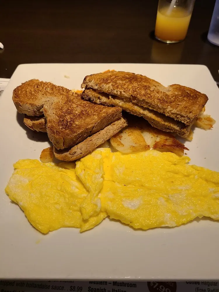 Scrambled Eggs Home Fries and Wheat Toast